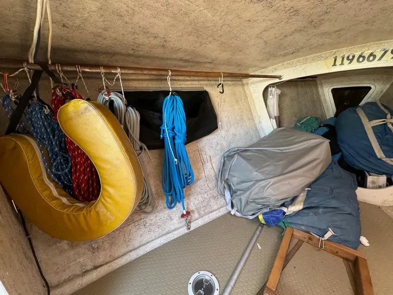 Slide: The Image of Interior of 1992 Catalina Capri 37 sailboat with ropes and equipment stored neatly. - 31