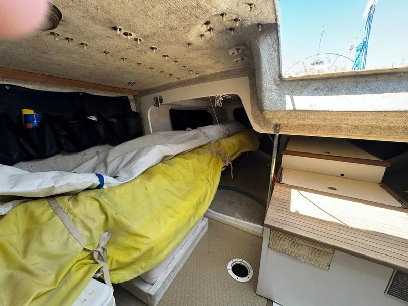 Slide: The Image of Interior of 1992 Catalina Capri 37 sailboat with stored sails and cabin details. - 33