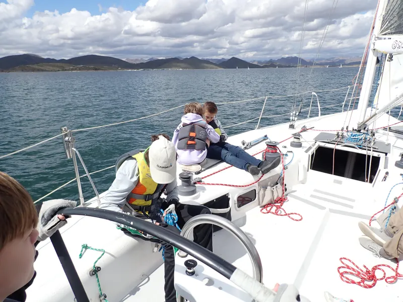 Slide: The Image of People sailing on a 1992 Catalina Capri 37, enjoying a sunny day on the water. - 8