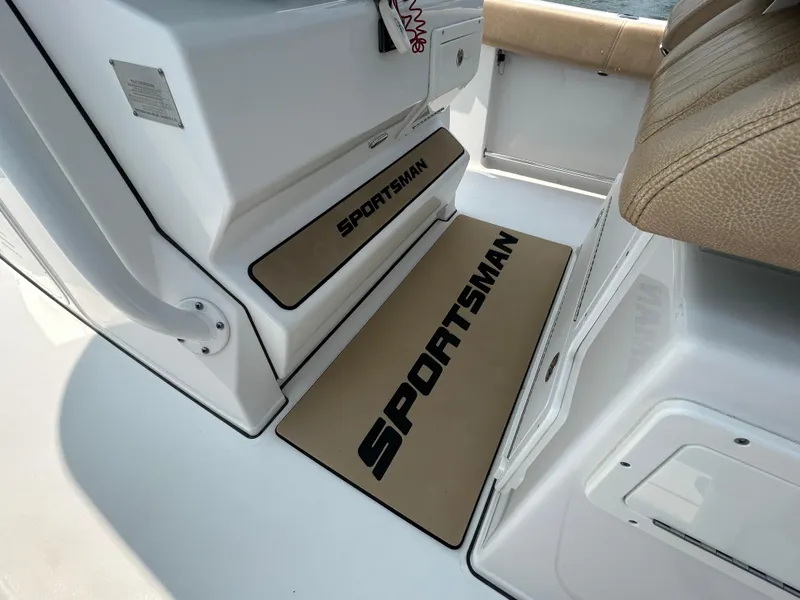 Slide: The Image of 2018 Sportsman Open 312 Center Console interior with branded floor mats. - 16