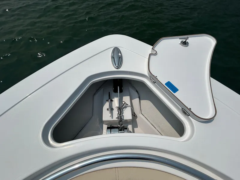 Slide: The Image of 2018 Sportsman Open 312 Center Console anchor compartment on calm water. - 28