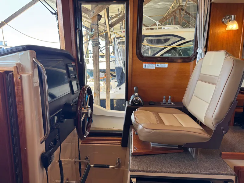 Slide: The Image of Interior of 2020 Ranger Tugs R-31 S boat with helm and captain's chair. - 21