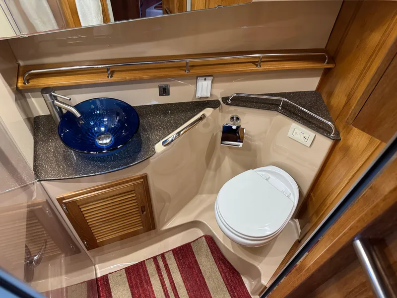 Slide: The Image of Bathroom interior of 2020 Ranger Tugs R-31 S with modern sink and toilet. - 26