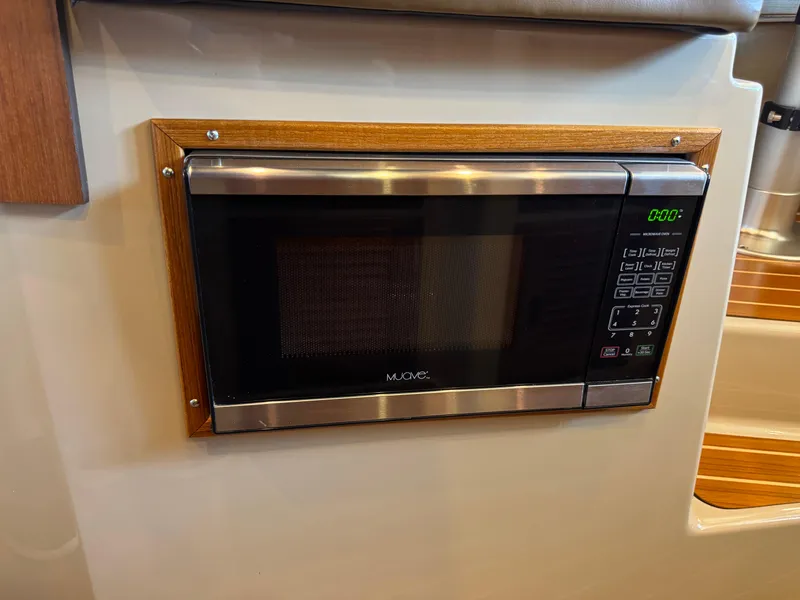 Slide: The Image of Built-in microwave in 2020 Ranger Tugs R-31 S boat interior. - 33