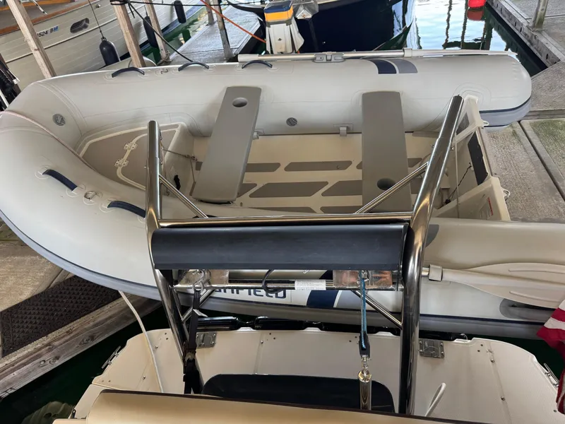 Slide: The Image of 2020 Ranger Tugs R-31 S inflatable boat docked at marina. - 34