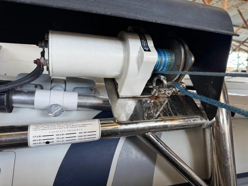 Slide: The Image of 2020 Ranger Tugs R-31 S boat winch system with blue rope and metal components. - 35