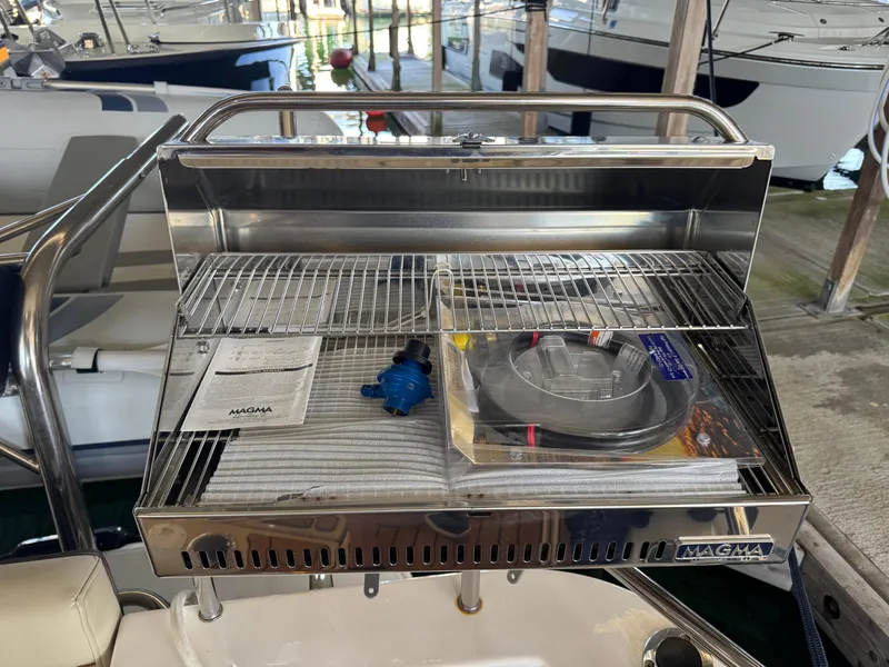 Slide: The Image of Stainless steel Magma grill on 2020 Ranger Tugs R-31 S boat, docked in marina. - 39