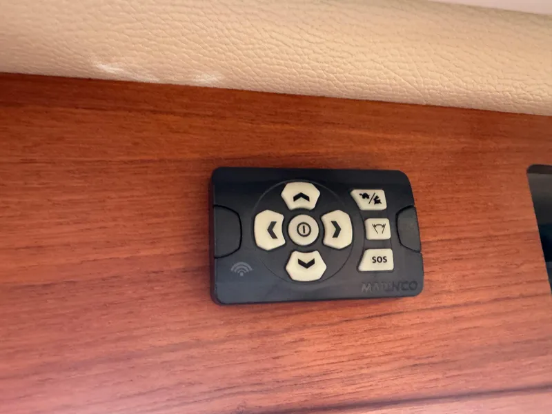 Slide: The Image of Control panel on 2020 Ranger Tugs R-31 S boat, featuring navigation and SOS buttons. - 49