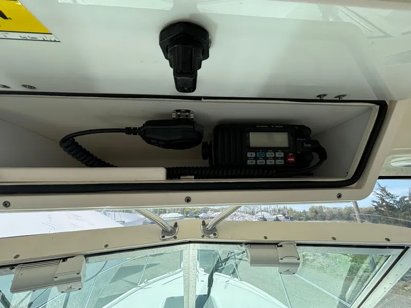 Slide: The Image of 2007 Pursuit 285 Offshore boat radio compartment with communication equipment. - 14