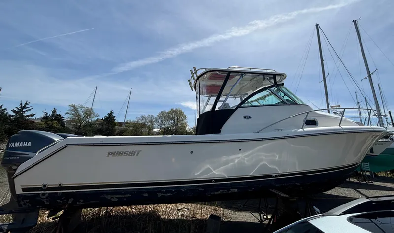 Slide: The Image of 2007 Pursuit 285 Offshore boat on display, featuring sleek design and Yamaha engine. - 2