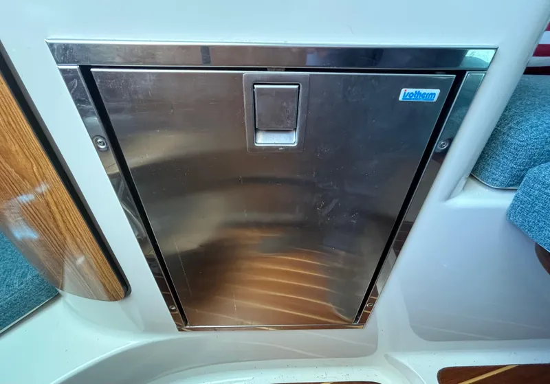 Slide: The Image of Stainless steel cabinet door on 2007 Pursuit 285 Offshore boat interior. - 21