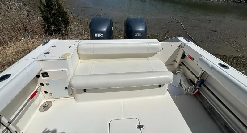 Slide: The Image of 2007 Pursuit 285 Offshore boat with dual 250 engines, featuring spacious seating and clean deck. - 6