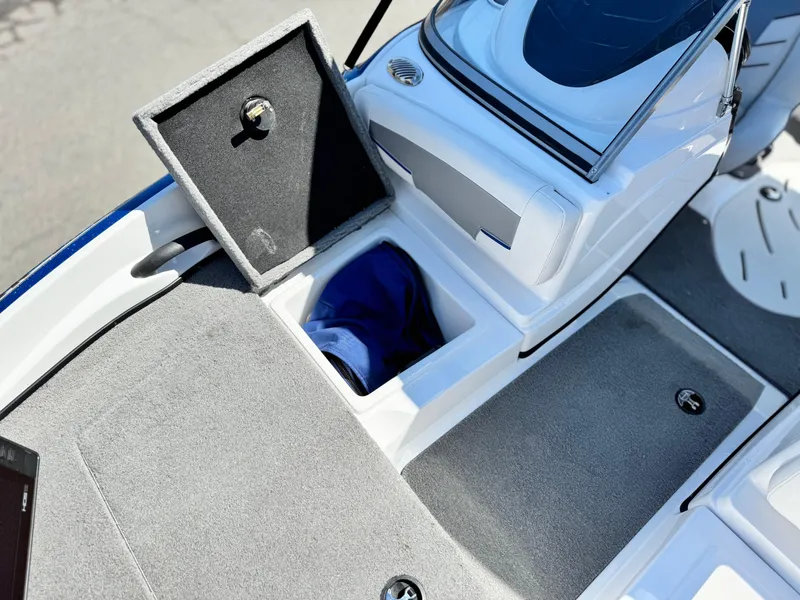 Slide: The Image of 2021 Nitro Z19 Sport boat interior with open storage compartments. - 15