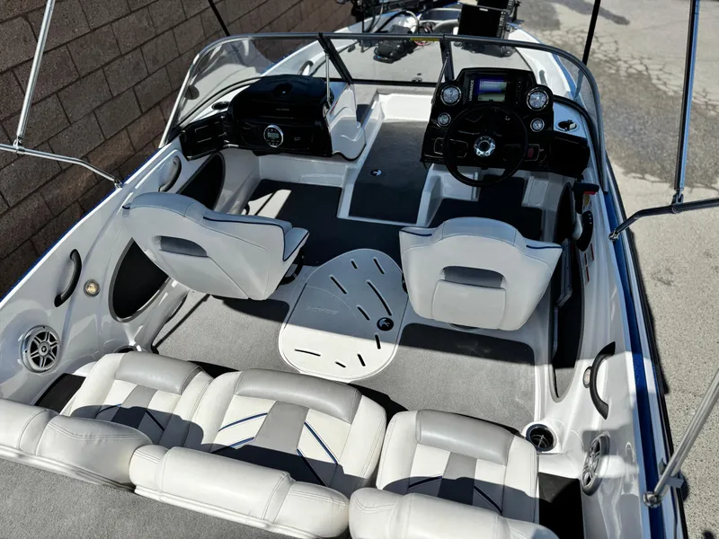 Slide: The Image of 2021 Nitro Z19 Sport boat interior with sleek seating and modern dashboard. - 17