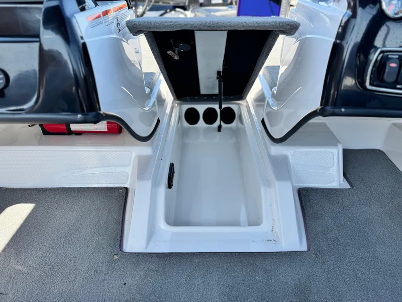 Slide: The Image of Interior view of a 2021 Nitro Z19 Sport boat, featuring storage compartments. - 19