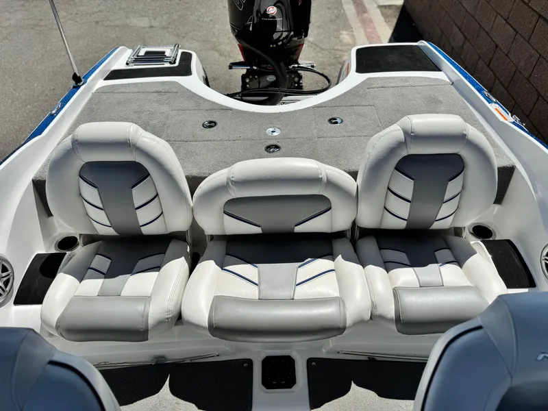 Slide: The Image of 2021 Nitro Z19 Sport boat interior with gray and white seating arrangement. - 20
