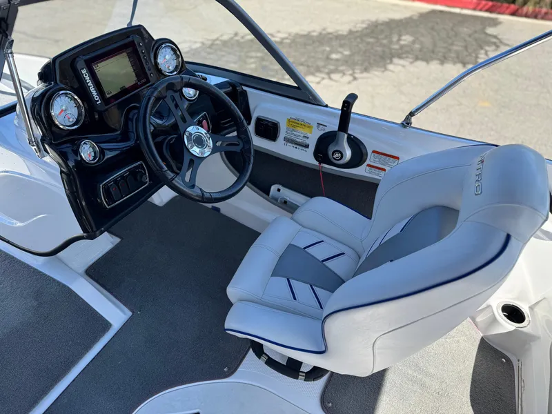 Slide: The Image of 2021 Nitro Z19 Sport boat cockpit with steering wheel and gauges. - 25