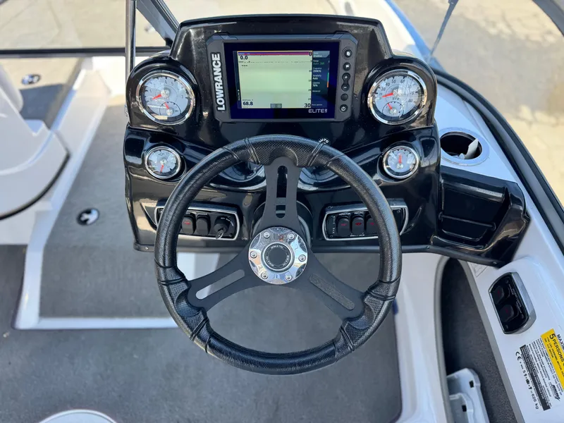Slide: The Image of Steering console of 2021 Nitro Z19 Sport boat with Lowrance display and gauges. - 26