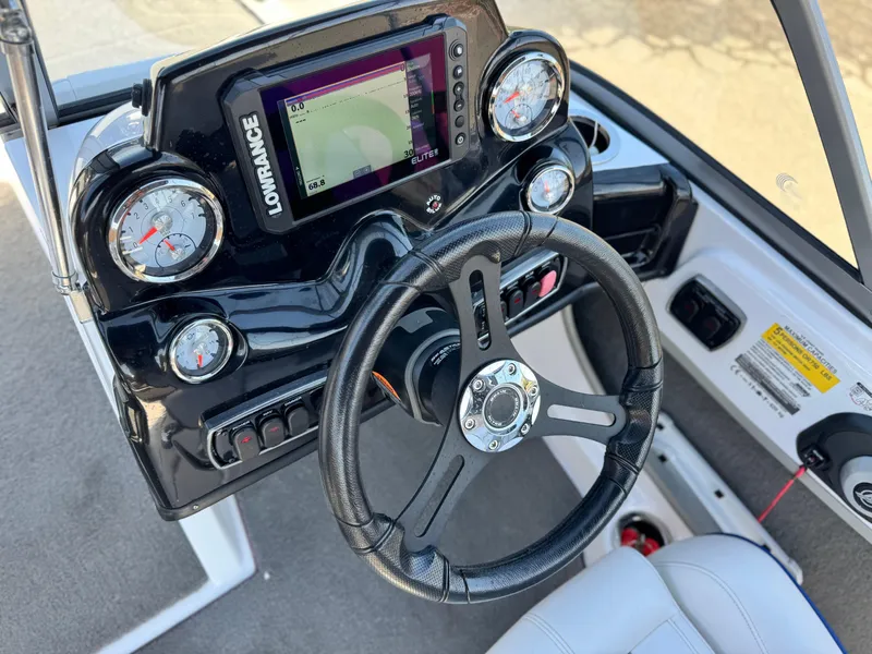 Slide: The Image of Steering console of a 2021 Nitro Z19 Sport boat with gauges and a Lowrance display. - 27