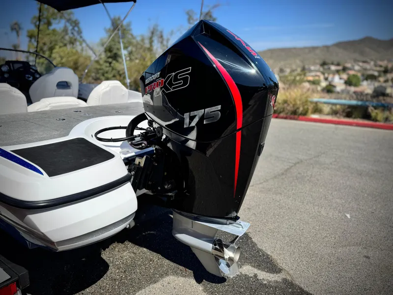 Slide: The Image of 2021 Nitro Z19 Sport boat with a 175 horsepower engine, parked outdoors. - 7