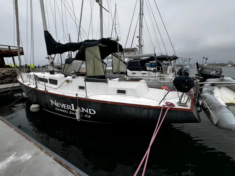 The Image of 1974 Irwin 37 Center Cockpit sailboat docked, named "Neverland," Channel Islands, CA. - 0