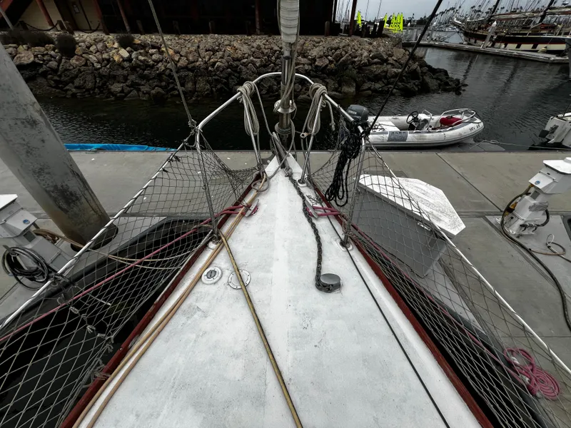 Slide: The Image of 1974 Irwin 37 Center Cockpit sailboat docked at marina, view from bow. - 10