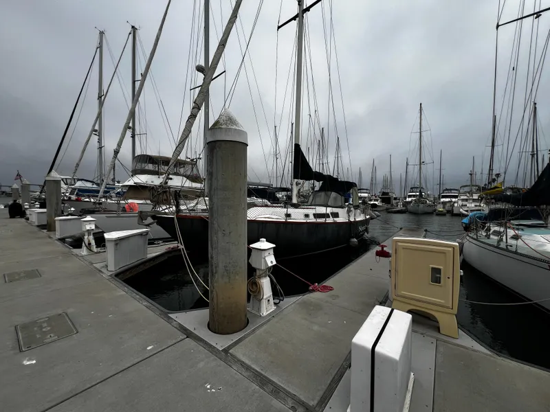 Slide: The Image of Sailboats docked at a marina, featuring a 1974 Irwin 37 Center Cockpit. - 3