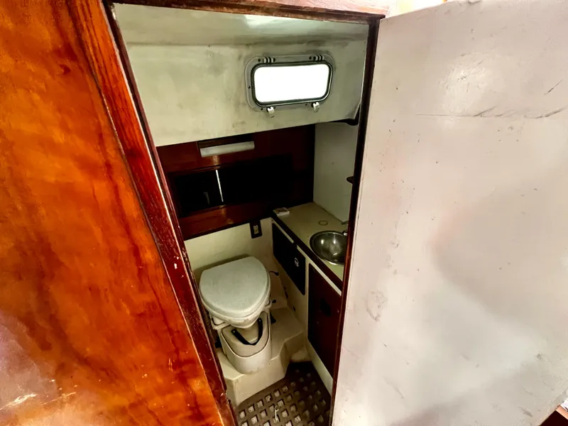 Slide: The Image of 1974 Irwin 37 Center Cockpit bathroom interior with toilet and sink. - 30