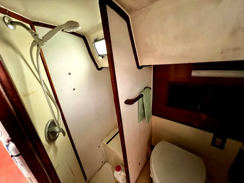 Slide: The Image of 1974 Irwin 37 Center Cockpit bathroom with shower and toilet. - 31