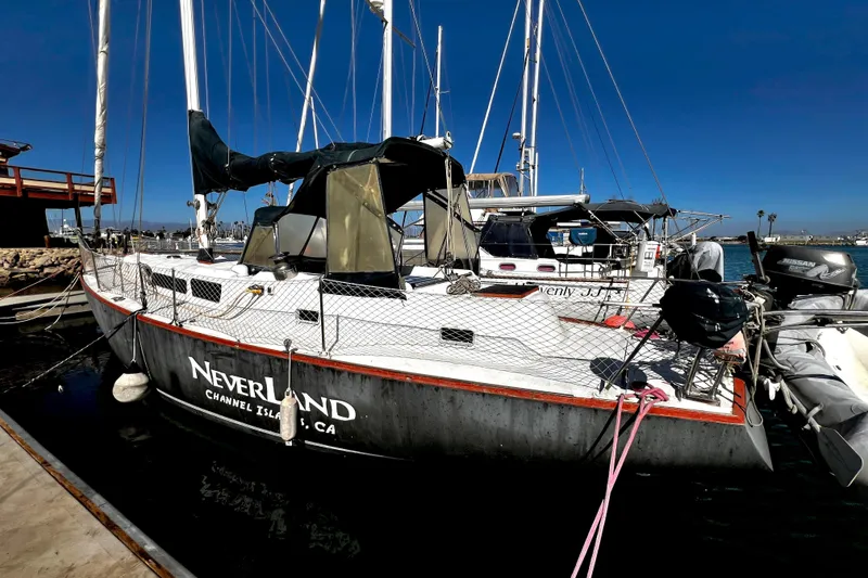 Slide: The Image of 1974 Irwin 37 Center Cockpit sailboat docked at Channel Islands, CA, named "Neverland." - 41