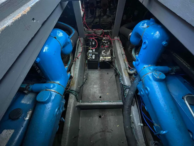 Slide: The Image of Engine room of 1988 Luhrs Tournament 400 Convertible with blue machinery and wiring. - 15