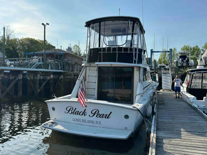 Slide: The Image of 1988 Luhrs Tournament 400 Convertible boat docked, named "Black Pearl," Long Island, NY. - 3