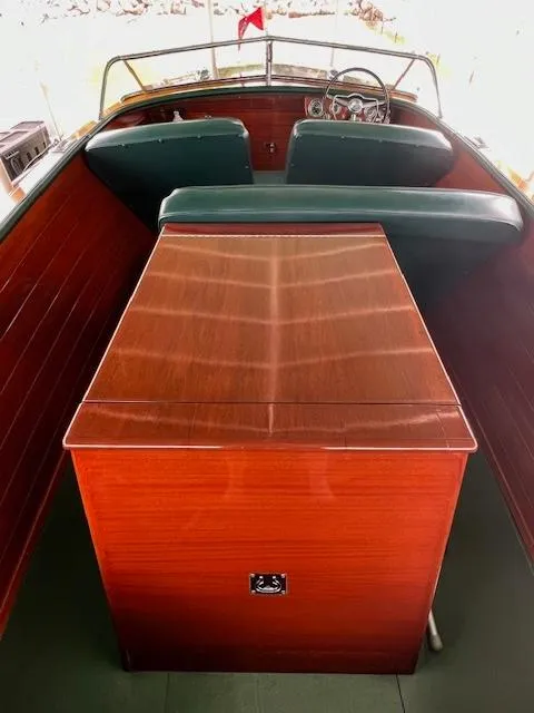 Slide: The Image of 1956 Chris-Craft 23 Continental boat interior with wooden finish and green seating. - 25