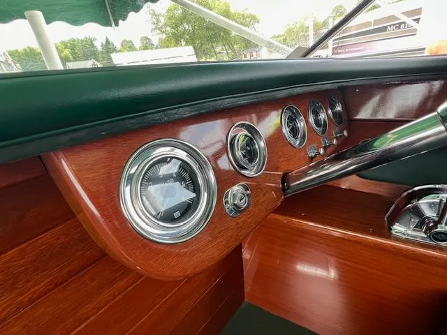 Slide: The Image of 1956 Chris-Craft 23 Continental dashboard with classic wooden finish and vintage gauges. - 30
