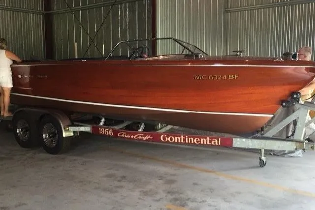Slide: The Image of 1956 Chris-Craft 23 Continental wooden boat on trailer in storage facility. - 5