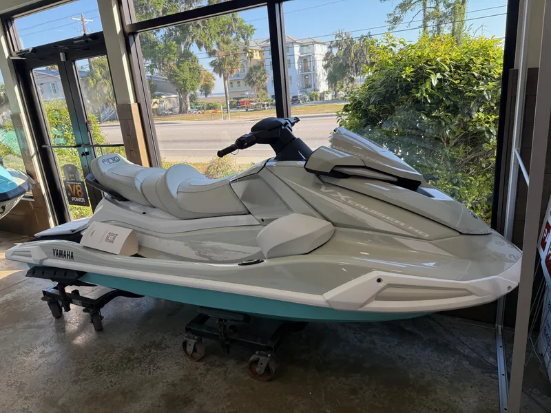 Slide: The Image of 2025 Yamaha VX1900B-BB jet ski displayed indoors, near large windows. - 1