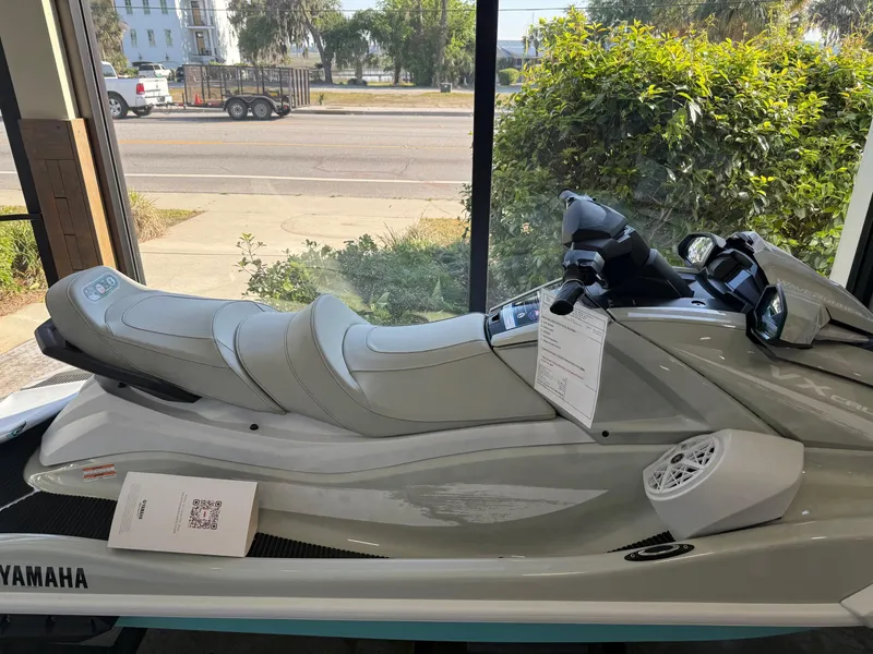 Slide: The Image of 2025 Yamaha Boats VX1900B-BB jet ski displayed indoors, side view. - 2