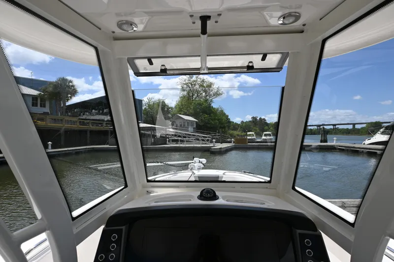 Slide: The Image of 2020 Robalo R272 Center Console boat interior view at marina. - 12