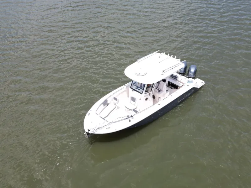 Slide: The Image of 2020 Robalo R272 Center Console boat on open water, aerial view. - 3