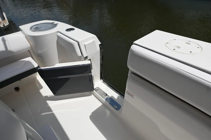 Slide: The Image of 2020 Robalo R272 Center Console boat interior with open side door. - 6