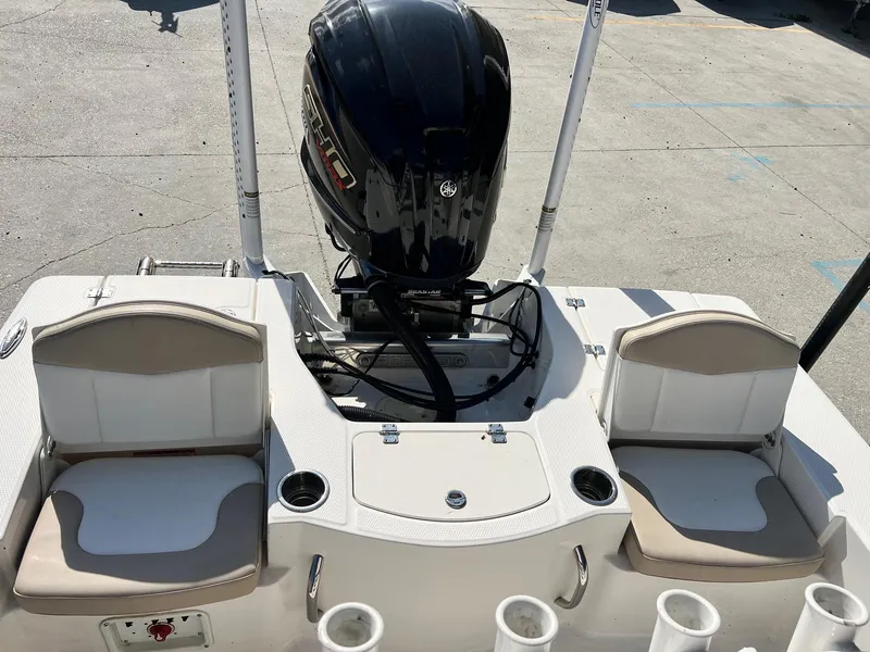 Slide: The Image of 2022 Robalo 206 Cayman boat with Yamaha engine and seating area. - 11