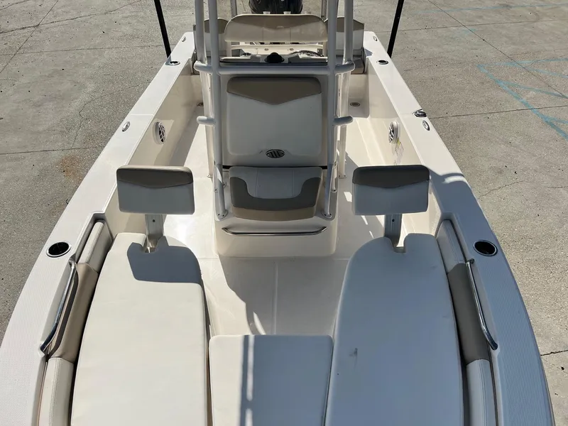 Slide: The Image of 2022 Robalo 206 Cayman boat interior with seating and console, viewed from above. - 15