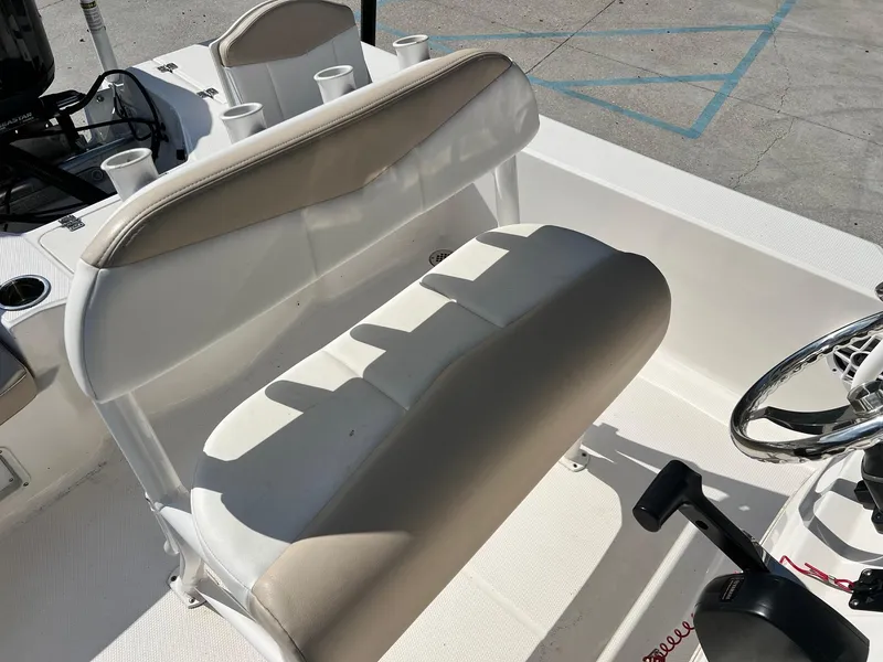 Slide: The Image of 2022 Robalo 206 Cayman boat interior with seating and steering wheel. - 7