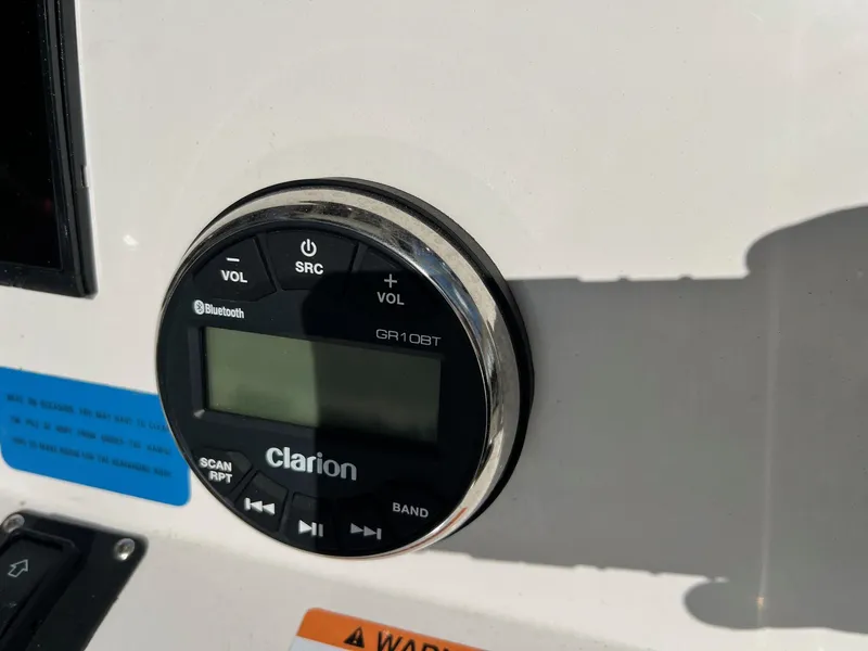 Slide: The Image of Clarion GR10BT audio system on 2022 Robalo 206 Cayman boat dashboard. - 9