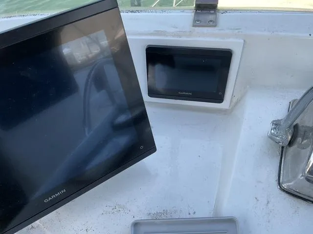 Slide: The Image of Control panel of a 1988 Jefferson 42 Sundeck with Garmin displays. - 12