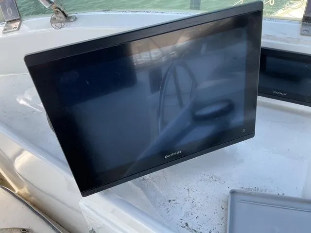 Slide: The Image of Garmin marine display on 1988 Jefferson 42 Sundeck yacht dashboard. - 13