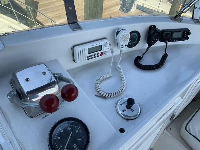 Slide: The Image of Control panel of a 1988 Jefferson 42 Sundeck boat with communication devices. - 15