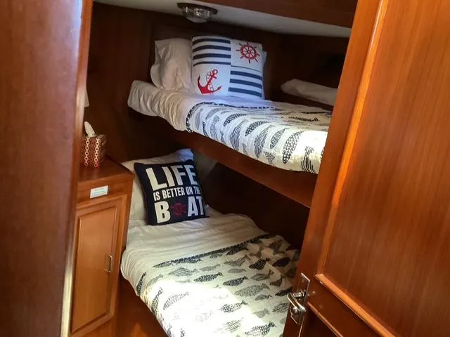 Slide: The Image of Cozy cabin with bunk beds on 1988 Jefferson 42 Sundeck yacht. - 2