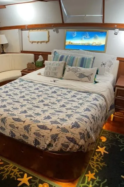 Slide: The Image of Cozy bedroom in 1988 Jefferson 42 Sundeck yacht with nautical decor and comfortable bedding. - 26