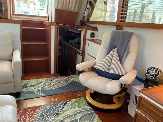 Slide: The Image of Interior of 1988 Jefferson 42 Sundeck yacht with cozy seating and nautical decor. - 30